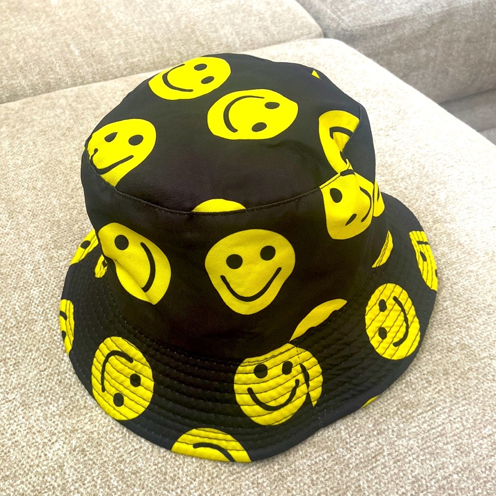 Black and yellow smiley face bucket hat
